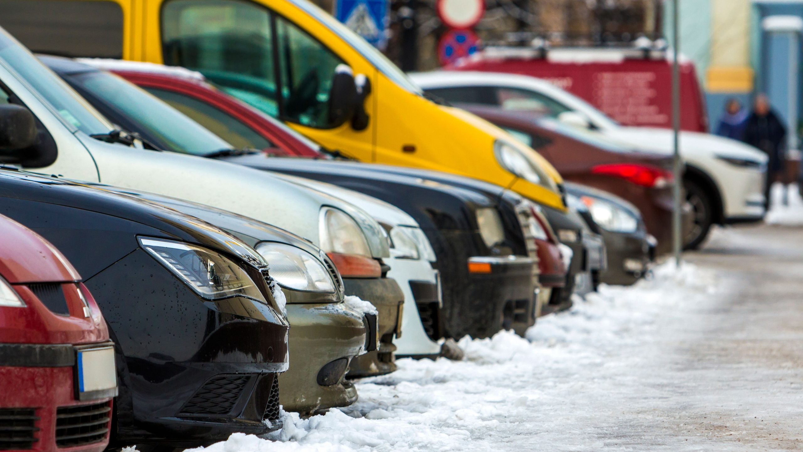 snowy car park with cars